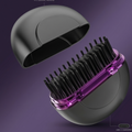 Hair dryer with a purple comb attachment on a purple background